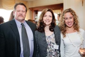 Honoree, Lynn Malone of Meeting Street (center), with husband Christopher Marsh and daughter Jamie Halpin  / Rupert Whitely