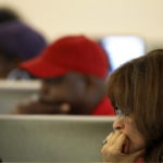 Job seekers look for work online at the Northside One Stop Career Center in Miami, Fla. Initial U.S. jobless claims initial jobless claims unexpectedly rose last week, a sign that the labor market is struggling to gain traction. / 