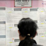 A JOB seeker looks at listings on a bulletin board in the One Stop Career Link Center in San Francisco, Calif. In May, the Rhode Island jobless rate remained unchanged but the state added 1,300 jobs for the month. / 