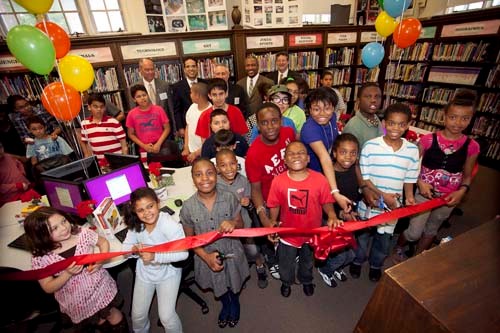 LOCAL STUDENTS gathered at the Smith Hill Community Library for the unveiling of the GTECH After School Advantage computer lab. Also present at the ribbon-cutting ceremony (back row, from left), was Providence City Councilman Terrence Hassett; Mayor Angel Taveras; Robert Vincent, senior vice president of corporate affairs for GTECH; and Marcus Mitchell, president of the Providence Community Library. / LOCAL STUDENTS gathered at the Smith Hill Community Library for the unveiling of the GTECH After School Advantage computer lab. Also present at the ribbon-cutting ceremony (back row, from left), was Providence City Councilman Terrence Hassett; Mayor Angel Taveras; Robert Vincent, senior vice president of corporate affairs for GTECH; and Marcus Mitchell, president of the Providence Community Library. /