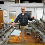 Rapid response keeps orders flowing STAMP OF APPROVAL: A.T. Wall Co. General Manager Al Goncalves says workers helped the company through the recession in 2009 by speeding up production of tubing and stamped components. Goncalves is standing with parts of a progressive die. /