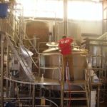 COURTESY COASTAL EXTREME BREWING/LAURA BLACKWELL COASTING ALONG: Reva Golden, a brewer, prepares the brew kettle to receive what will become the latest batch of Hurricane Amber Ale, the brewery&rsquo;s most popular beer. /