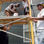 BUILDING SOMETHING: YouthBuild Providence participants, from left: Richard Bridges, Lionel Brown, Karan Sol and Cesar Ramirez. / 