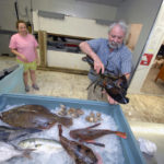 CATCHING ON: Richard A. Cook, owner and operator of The Local Catch in Narragansett, sells seafood at seven farmers markets in Rhode Island. He is certain the demand is there to support local sales. / 
