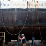 FLOATING CLASSROOM: Promet Marine Service Corp. workers are preparing the hull of the planned three-masted tall ship Oliver Hazard Perry. A nonprofit has raised more than $1 million so far. / 
