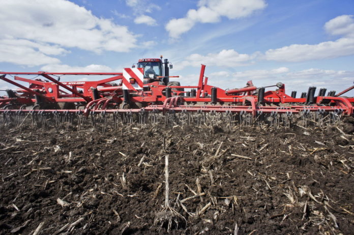 A PLOUGH prepares farmland for the planting of wheat. U.S. farmland values rose to a record as crop and livestock prices surged and demand for exports jumped. / 