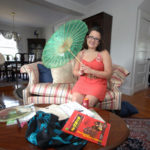 FOREIGN EXCHANGE: University of Rhode Island sophomore Jennifer Parisi shows off mementos from her time studying in China. / PBN PHOTO/BRIAN MCDONALD