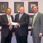 FROM LEFT: Nat Calamis, president and CEO of Starkweather & Shepley, Raymond Geary, resident vice president of EMC and William McGillivray, chairman and chief financial officer of Starkweather & Shepley. / COURTESY STARKWEATHER & SHEPLEY