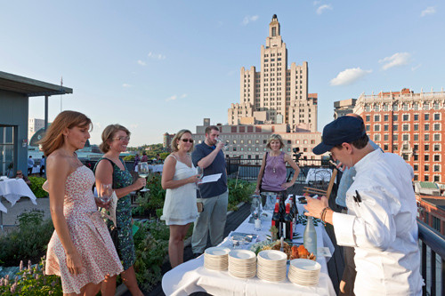 COURTESY GRACIE'SABOVE IT ALL: Patrons at the Gracie's-run Wines of the World event in July. The restaurant has held events and catered private functions on top of the Peerless Building for three years. COURTESY GRACIE'SABOVE IT ALL: Patrons at the Gracie's-run Wines of the World event in July. The restaurant has held events and catered private functions on top of the Peerless Building for three years.