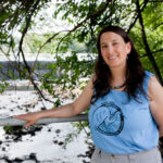 CLEANING UP: Alicia Lehrer, executive director of the Woonasquatucket River Watershed Council, at the Allendale Mill Pond in North Providence. / PBN PHOTO/NATALJA KENT