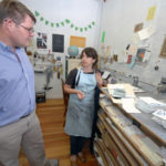 Mill a haven amid city’s bankruptcy NEW LIFE: Jerauld Adams, owner of the Hemphill Mill in Central Falls, speaks with tenant Elana Wetzner. The building has approximately 75 tenants. / PBN PHOTO/BRIAN MCDONALD