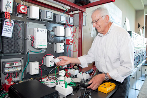 ON THE GRID: Jerry Bernardini, chairman of the Engineering and Technology Department at CCRI, demonstrates some of the new equipment that will be used in a joint program offered by the school and National Grid. / PBN PHOTO/NATALJA KENT ON THE GRID: Jerry Bernardini, chairman of the Engineering and Technology Department at CCRI, demonstrates some of the new equipment that will be used in a joint program offered by the school and National Grid. / PBN PHOTO/NATALJA KENT