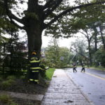 Fire department officials attend to a downed power pole in Princeton, N.J. / BLOOMBERG NEWS PHOTO JOHN MCCORRY