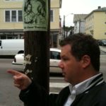 COURTESY R.I. PARANORMAL ACADEMY
TOUR GUIDE: Frederick Wilmott, standing near a utility pole bearing a poster for R.I. Paranormal Academy ghost tours, leads a private tour in Providence earlier this year.