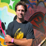 STREET ART: Yarrow Thorne, owner of Yarrow's Cans, has been helping to make graffiti an asset to the community. He's linked respected graffiti artists with businesses for murals, among other things. / PBN PHOTO/FRANK MULLIN