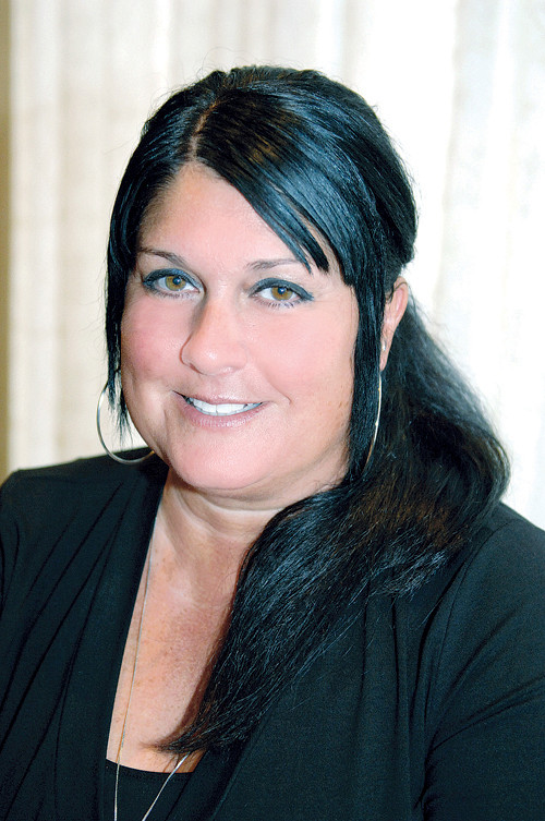 GOOD COMPANY: Sherri Lynn Carrera, small-business ombudsman for EDC, says that Every Company Counts has helped more than 3,000 small-business owners since she arrived. / PBN PHOTO/BRIAN MCDONALD GOOD COMPANY: Sherri Lynn Carrera, small-business ombudsman for EDC, says that Every Company Counts has helped more than 3,000 small-business owners since she arrived. / PBN PHOTO/BRIAN MCDONALD