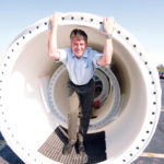 EDC fund gives firms energy jolt WHIRLWIND: Rick Hodges, president of Hodges Badges in Portsmouth, with a windmill that a $225,000 Renewable Energy Fund grant will help pay for. / PBN PHOTO/BRIAN MCDONALD