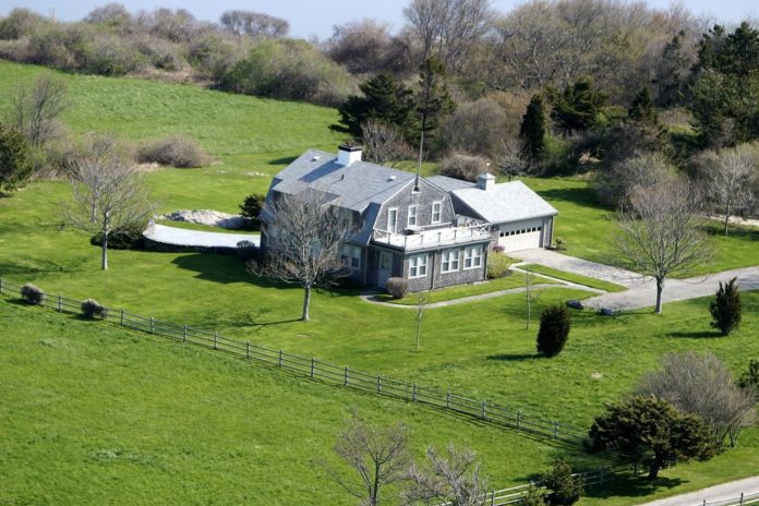 THE 11-ROOM SHINGLED HOUSE includes 2,759-square-feet of living space, five bedrooms and four bathrooms. The seven-acre property also comes with a separate guesthouse and garage.  / COURTESY RESIDENTIAL PROPERTIES