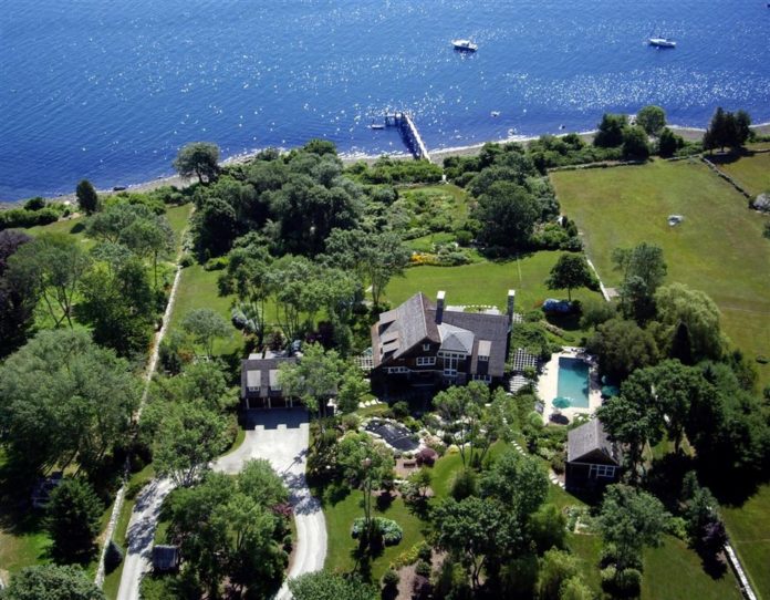 KNOWN AS Daybreak, the home sits on 5.8 acres of land along the East Passage of Narragansett Bay. Built in 2004, the mansion includes five bedrooms, six full baths, one lavette, a gourmet kitchen and a billiard room.  / COURTESY LILA DELMAN