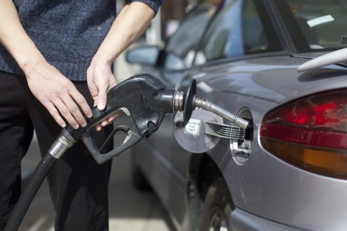 GAS prices in Rhode Island and Massachusetts were down slightly this week, AAA Southern New England reported Monday. / BLOOMBERG NEWS FILE PHOTO/ANDREW HARRER