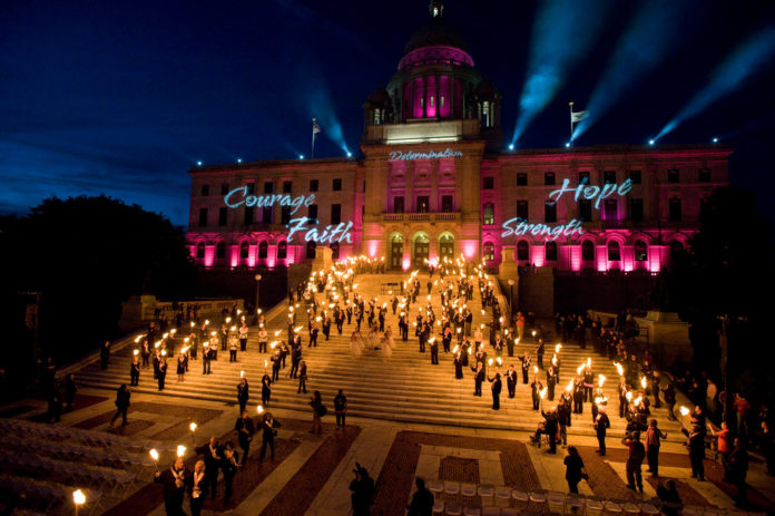 FLAMES OF HOPE Statehouse special lighting ceremony in 2010. / COURTESY GLORIA GEMMA BREAST CANCER RESOURCE FOUNDATION FLAMES OF HOPE Statehouse special lighting ceremony in 2010. / COURTESY GLORIA GEMMA BREAST CANCER RESOURCE FOUNDATION