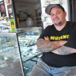 INDELIBLE MARK: Michael Gray, owner of Marks of Identity in Providence, sells hundreds of ink colors out of the tattoo- and body-piercing-supply shop. His customers come from all over New England. / PBN PHOTO/FRANK MULLIN