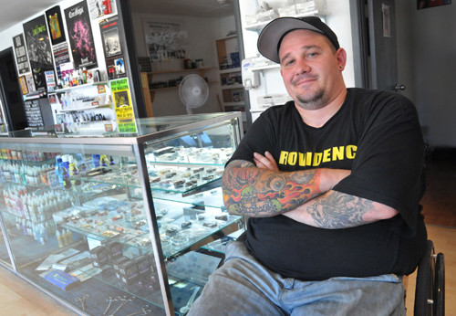 INDELIBLE MARK: Michael Gray, owner of Marks of Identity in Providence, sells hundreds of ink colors out of the tattoo- and body-piercing-supply shop. His customers come from all over New England. / PBN PHOTO/FRANK MULLIN INDELIBLE MARK: Michael Gray, owner of Marks of Identity in Providence, sells hundreds of ink colors out of the tattoo- and body-piercing-supply shop. His customers come from all over New England. / PBN PHOTO/FRANK MULLIN