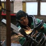 COURTESY STEEL YARD
METAL TASTE: Carlos Ruiz, 18, works on ocean-inspired bike rack he designed and built at the Steel Yard.