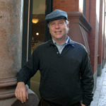 THE GREAT CHACE: Cornish Associates President and CEO Arnold"Buff" Chace Jr. in front of the Peerless Lofts. That building was one of several in downtown Providence that his company redeveloped. / PBN PHOTO/BRIAN MCDONALD