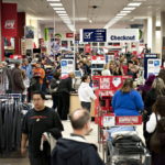 SHOPPERS browse merchandise in a Sears store at Simon Property Group Inc.'s Great Lakes Mall in Mentor, Ohio. Black Friday, traditionally the biggest U.S. shopping day of the year, got off to its earliest start ever as retailers tried to woo shoppers with discounts and early store openings.  / COURTESY BLOOMBERG NEWS FILE PHOTO DANIEL ACKER
