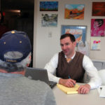 VALUABLE TIME: Jeffrey Biolchini, facing camera, attorney at Ratcliffe, Harten, Burke and Galamaga, gives pro bono legal advice. Eliza Vorenberg, director of Feinstein Institute for Legal Service's Pro Bono Collaborative, looks on. / PBN PHOTO/BRIAN MCDONALD