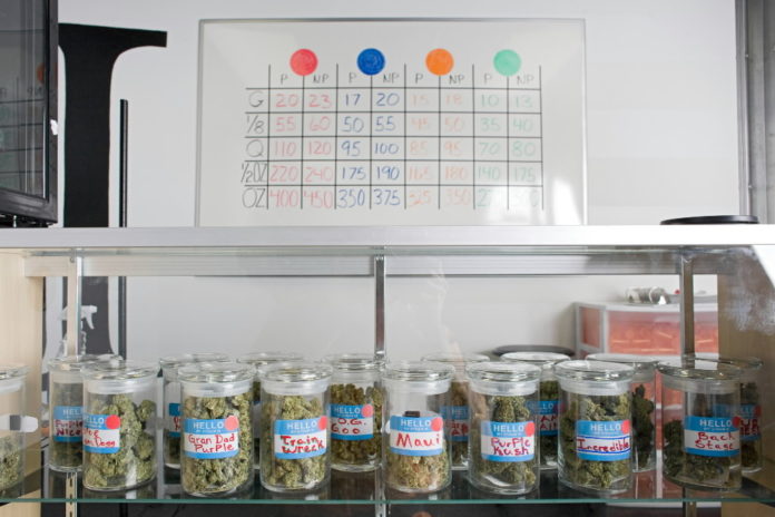 CANISTERS of medical marijuana and a price list for the marijuana products is seen inside Highland Health medical dispensary and wellness center in Denver, Colo. / BLOOMBERG NEWS FILE PHOTO MATTHEW STAVER CANISTERS of medical marijuana and a price list for the marijuana products is seen inside Highland Health medical dispensary and wellness center in Denver, Colo. / BLOOMBERG NEWS FILE PHOTO MATTHEW STAVER