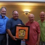 FROM LEFT: Dale Klatzker, president and CEO of The Providence Center, presents a plaque to Chelo’s family members Gary Chelo, Benny Chelo and Craig Chelo in appreciation for the $11,078 donation Chelo’s 24th annual Golf Tournament raised for the nonprofit.