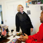 Helping others a commitment she’s happy to fulfill HOUSE BECOMES A HOME: Eileen Hayes, president and CEO of Amos House, speaks with case manager Sonny Ramsey. She oversees a staff of 55. / PBN PHOTO/RUPERT WHITELEY