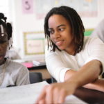 R.I. sees ‘dramatic improvement’ on education ranking A MIDDLE school principal in Washington D.C. works with a student. Rhode Island ranked 20th on this year's Quality Counts education report. / BLOOMBERG NEWS FILE PHOTO