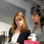 CROWN JEWEL: Alex and Ani Design Manager Emily McKenna, left, talks with company owner Carolyn Rafaelian. The company is giving Bryant $1 million over 10 years. / PBN FILE PHOTO/BRIAN MCDONALD