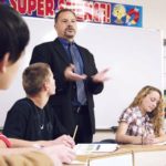 MAKING CENTS: Robert Scaffardi, academic-program director at New England Laborers/Cranston Public Schools Construction and Career Academy, speaks to students at the school. His efforts spurred a financial-literacy curriculum at the 240-student school. / PBN PHOTO/MICHAEL PERSSON