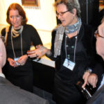THE I IN TEAM: Dr. Anne S. De Groot, facing camera, right, and Denice Spero, facing camera, left. De Groot co-founded iCuded and recruited Spero, a scientist, to join the institute. / PBN FILE PHOTO/FRANK MULLIN
