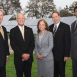 COURTESY R.I. EDC
SHINING EXAMPLE: After decrying large corporate incentives,, Gov. Lincoln D. Chafee, left, came on board for a $1 million grant to Toray Plastics to build a solar power array backed by EDC Executive Director Keith W. Stokes, right. With the two at the unveiling of the array are Toray president and CEO, Richard Schlosser, second from left, R.I. Senate President M. Teressa Paiva Weed and URI President David M. Dooley.