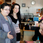 GIVING HOPE: From left: Cl&iacute;nica Esperanza/Hope Clinic Vida Sana Director Lavinia Velazquez, Medical Assistance Program Center case manager Luz Betancur and Together We Insure A Safer Tomorrow Assistant Program Manager Angela Amaral. / PBN PHOTO/RUPERT WHITELEY