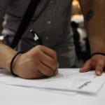 A JOB seeker fills out an application during a career fair sponsored by National Career Fairs in Houston, Texas. / BLOOMBERG NEWS FILE PHOTO AARON M. SPRECHER