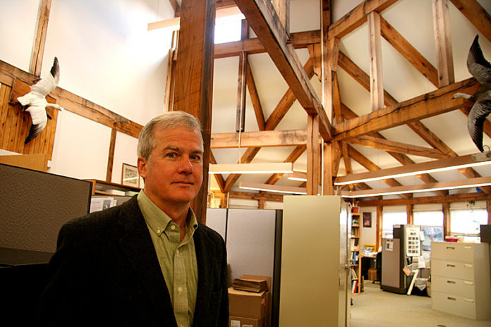 TAKE AND RECEIVE: Audubon Society of Rhode Island Executive Director Lawrence Taft stands in office space that he is hoping to lease through the Non-Profit Exchange. / PBN PHOTO/MICHAEL PERSSON