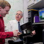 Combating spammers is
a cost of doing business GETTING THROUGH: NetCenergy President Donald Nokes, right, with network engineer Greg Morrell at the company's Warwick headquarters. / PBN PHOTO/NATALJA KENT
