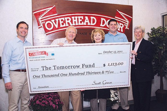 FROM LEFT: Overhead Door Co./Garage Headquarters President Scott Grace and Founder Jim Grace present a $1,113 donation to Barbara Ducharme, executive director of The Tomorrow Fund; Dan Belhumeur, vice president of The Tomorrow Fund; and Kathleen Connolly, development director of The Tomorrow Fund.