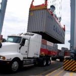 Lawmakers urged to support R.I. port improvements A CONTAINER is loaded onto a truck at the Port of Boston. / BLOOMBERG NEWS FILE PHOTO JB REED