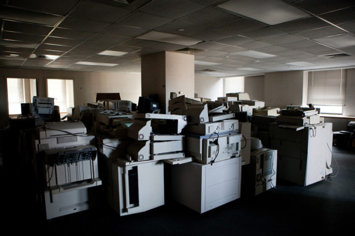 EMPTY SPACE: The middle floors of the Bank of America building downtown include stored electronics in vacant offices. / PBN PHOTO/RUPERT WHITELEY
