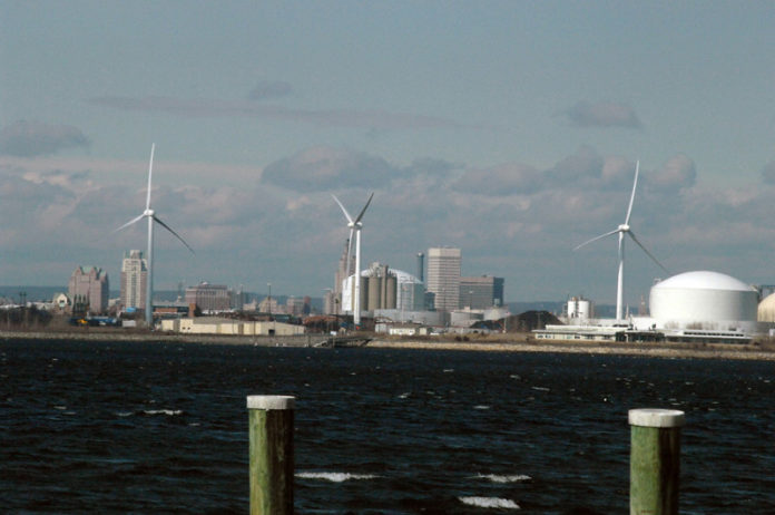ROUND AND ROUND: Wind turbines at Field's Point in Providence are part of a $12.2 million Narragansett Bay Commission project, expected to pay for itself by 2026. / PBN PHOTO/BRIAN MCDONALD