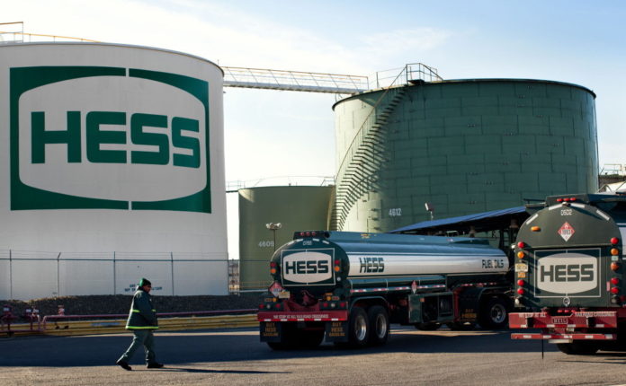 A HESS Corp. truck pulls into a fueling station at the Hess petroleum terminal in Bogota, N.J. / BLOOMBERG NEWS FILE PHOTO/EMILE WAMSTEKER