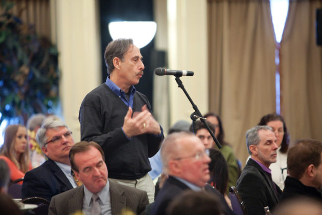 An audience member addresses the panelists / RUPERT WHITELY
