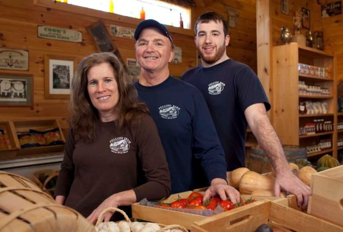 FARM HANDS: Anthony and Donna Pelloni started their business in 2007 after purchasing the 96-acre Hopkinton property in 1983. At right is their son, Tom Pelloni. / PBN PHOTO/DAVID LEVESQUE